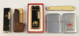 A gentleman's gold plated engine turned Dunhill cigarette lighter in leather pocket and minor lighters