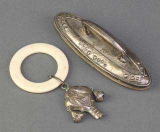 A repousse silver nail buffer Birmingham 1912, a repousse rattle/teether 