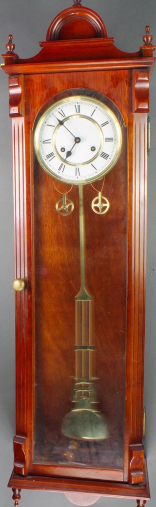 A Vienna style striking regulator with 7" enamelled dial, Roman numerals, grid iron pendulum contained in a mahogany case 
