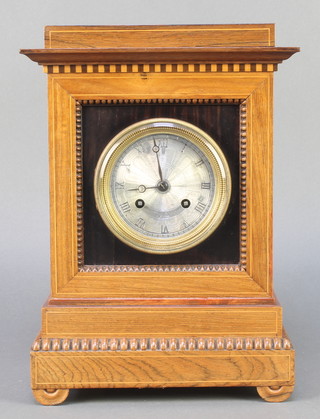 A 19th Century French 8 day striking mantel clock, the silvered dial marked Banister & Stephenson Paris with Roman numerals contained in an inlaid rosewood case, striking on a bell 