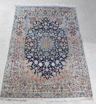 A white and blue ground Persian Nain rug with central medallion with multi row borders 84" x 57" 