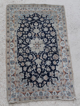 A Persian blue and white ground Nain rug with central medallion and floral ground 53" x 30", some wear 

