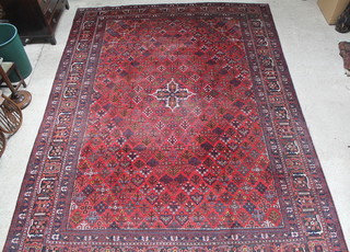 A red and blue ground Persian Josheghan carpet 174" x 132", some wear 