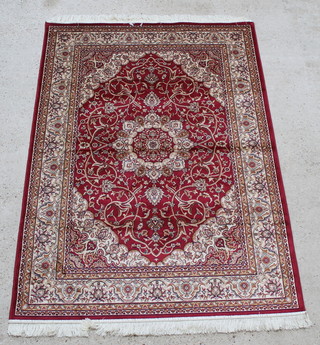 A red and gold patterned Keshan style Belgian cotton rug with central medallion 76" x 52"  