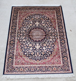 A blue and red ground Keshan style Belgian cotton rug with central medallion 76" x 52" 