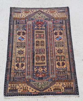 A brown and blue ground Belouche rug with elongated central medallion 56" x 36" 