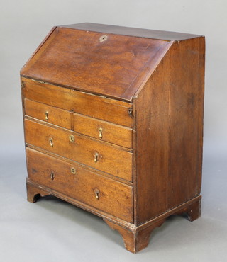 An 18th Century oak bureau, the fall front revealing a stepped fitted interior with well above 2 short and 2 long drawers, raised on bracket feet 40"h x 36"w x 20"d 