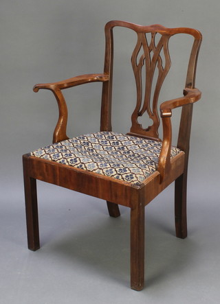 A Georgian mahogany Chippendale style carver chair with vase shaped splat back and upholstered  drop in seat, raised on square tapered supports 