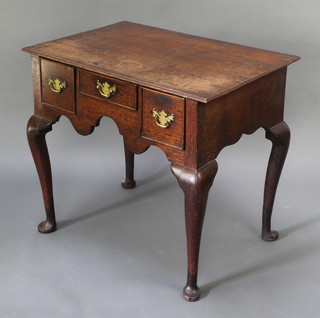 An 18th Century oak low boy fitted 1 long and 2 short drawers, raised on cabriole supports 27"h x 30 1/2"w x 21"d 