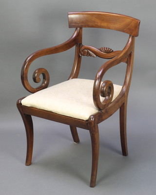 A Georgian mahogany desk/carver chair with carved mid rail and upholstered drop in seat on sabre supports