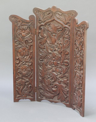 A Victorian carved mahogany 3 fold fire screen carved birds with outstretched wings 32"h x 29" when open x 15" when closed 