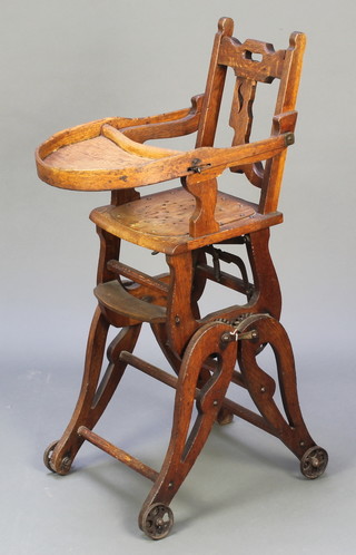 A child's Edwardian oak metamorphic high chair with shaped slat back (f) 
