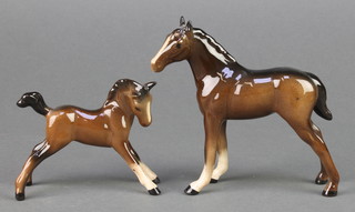 A Beswick figure of a brown foal 4 1/2", a ditto with legs outstretched 2 3/4" 