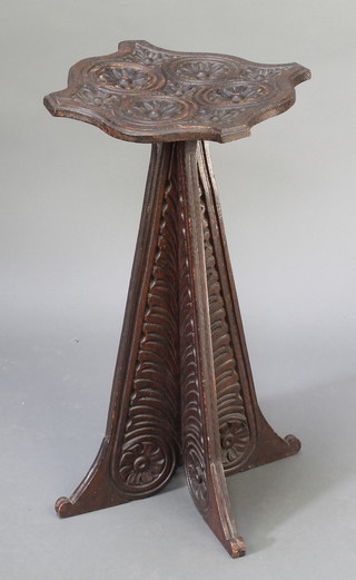 A Continental Art Nouveau oak shaped and carved occasional table raised on waisted panel supports 25"h x 11"w x 12"d  