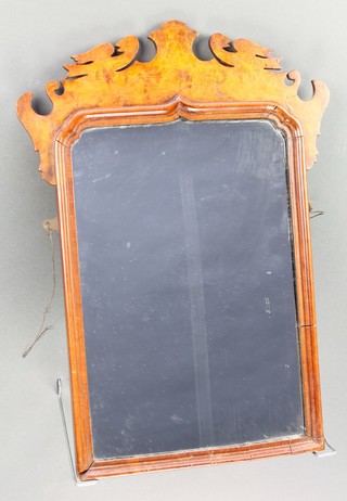 A 19th Century Queen Anne style arched plate mirror contained in a figured walnut frame 20"h x 11"w 