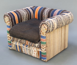 A Chesterfield style armchair upholstered in Kilim fabric (small patch of wear to the back right hand corner) 