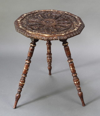 A 19th Century Anglo Indian rosewood and inlaid ivory dodecagon shaped occasional table the top carved deities raised on 3 turned supports 22"h x 18" square 