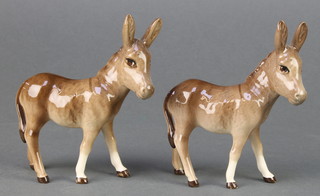 A Beswick figure Donkey foal 2110, gloss, 4 1/2" and a ditto 