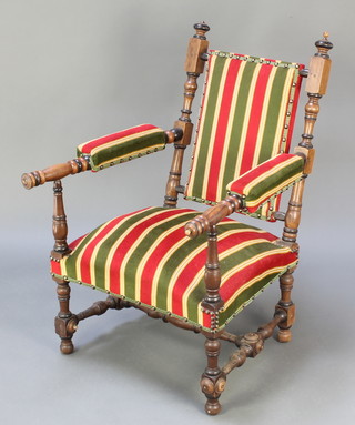 A turned walnut open arm chair with turned and block supports 
