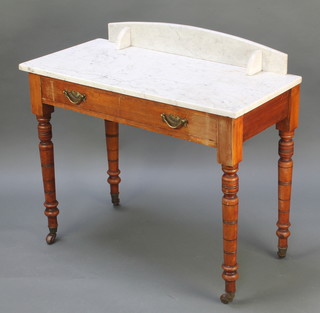A Victorian bleached mahogany wash stand with white veined marble top and raised back, fitted 1 long drawer, raised on turned supports 33"h x 36"w x 17 1/2"d 