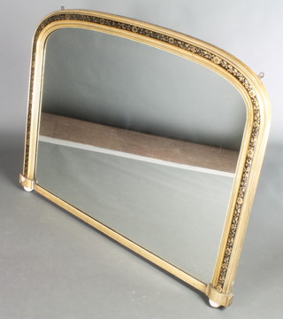 A Victorian arched plate over mantel mirror contained in a gilt and ebonised frame, raised on ceramic bun feet 37"h x 47"w 