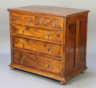A Queen Anne figured walnut chest, the quarter veneered top with crossbanding, fitted 2 short and 3 long drawers with brass pear drop handles, raised on bun feet 33"h x 37"w x 22"d 