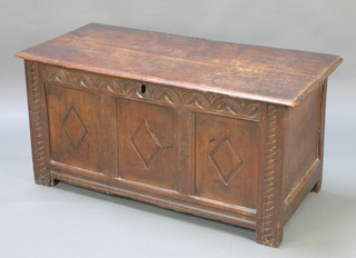 An 18th Century carved oak coffer of panelled construction with hinged lid, the interior fitted a candle box 22"h x 45"w x 21"d 