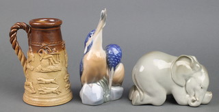 A Danish figure of Kingfishers 7", a Doulton stoneware tapered jug and a Russian figure of a reclining elephant