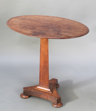 A William IV oval mahogany occasional table raised on a chamfered column with triform base, bun feet 25 1/2"h x 27"w x 19" 