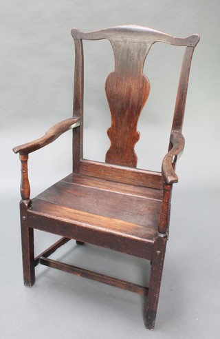 An 18th Century oak Wainscot chair with vase shaped slat back and solid seat and H framed stretcher 
