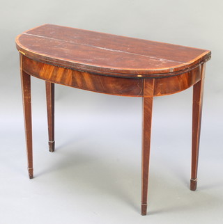 A Georgian inlaid mahogany D shaped card table with crossbanded top, raised on square tapering supports, spade feet 28"h x 36"w x 18"d  