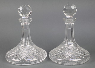 A pair of cut glass ships decanters 10" 