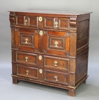 A Jacobean oak chest of 4 long drawers with geometric mouldings, brass escutcheon locks, raised on square supports 42"h x 42"w x 21 1/2"d 