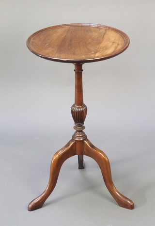 A Georgian style circular turned mahogany wine table raised on a pillar and tripod base 26"h x 14 1/2" 