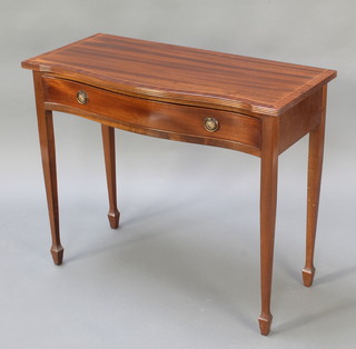 A Georgian style mahogany sideboard of serpentine outline and crossbanded top, fitted 1 long drawer raised on square tapering supports ending in spade feet 30"h x 36"w x 16"d 