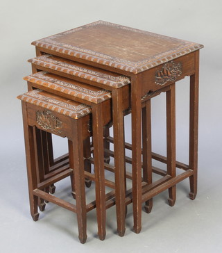 A nest of 4 Chinese carved hardwood interfitting coffee tables 20 1/2" x 12" x 10 1/2", 22"h x 15"w x 12"d, 23" x 18" x 13 1/2", 26"h x 21"w x 15"d 