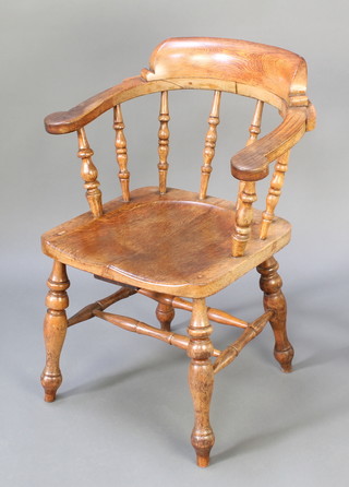 Of Railway interest, a 19th Century elm Great Western Railways Station Masters smokers bow chair, the base impressed G.W.R. 