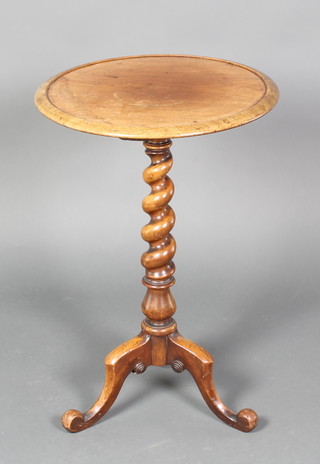 A Victorian circular mahogany dish top wine table, raised on a spiral turned column and tripod base  28"h x 17" diam. 