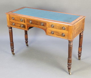 A Victorian rectangular mahogany writing table with inset writing surface above 1 long and 4 short drawers raised on turned supports 31"h x 45 1/2"w x 19"d 