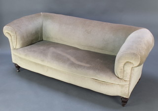 A Chesterfield style sofa upholstered in light green Dralon raised on turned supports 27"h x 71"w x 29"d 