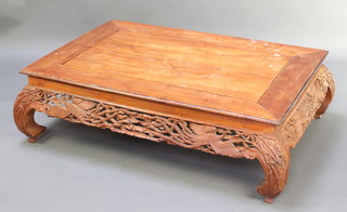 A Chinese rectangular hardwood opium table with pierced apron decorated Ho Ho birds and raised on shaped supports 14" x 47"w x 31"d 