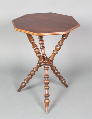 A Victorian octagonal mahogany gypsy table raised on turned supports 26"h x 20"w x 20"d  