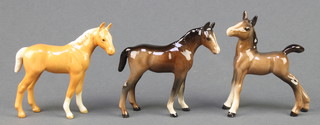 Three Beswick animals - standing pony 3", standing foal 3" and standing palamino pony 3" 