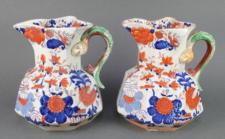 A pair of 19th Century Ironstone jugs with serpent handles 9 1/2" 