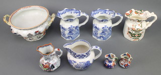 Seven Ironstone jugs together with a 2 handled tureen 