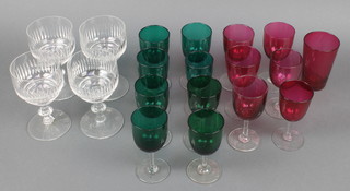 Four clear glass wine glasses with faceted bowls, 7 Victorian cranberry cups and 8 Victorian green glass wines 