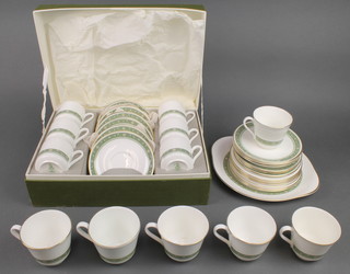 A Royal Doulton Rondelay tea set comprising 6 tea cups, 6 saucers, 6 small plates and a sandwich plate together with a boxed set of 6 coffee cans and saucers