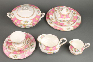 An extensive Royal Albert Lady Carlisle tea, coffee and dinner service comprising 12 tea cups, 12 saucers, 7 coffee cups, 10 small plates, 12 medium plates, 12 dinner plates, 12 soup bowls, 10 dessert bowls, a sauce boat and stand, 2 tureen with lids, 2 oval meat plates a sugar bowl and lid