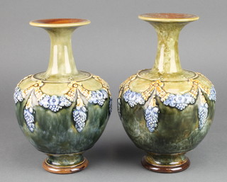 A pair of Royal Doulton oviform vases decorated with swags on a blue, green ground with flared necks, stamped 83, 8 1/2" 
