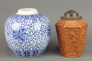 A Chinese earthenware hexagonal tea caddy, the moulded decoration with exotic birds having pewter cover and lid 7" together with a Chinese blue and white ginger jar with formal floral decoration 7" 